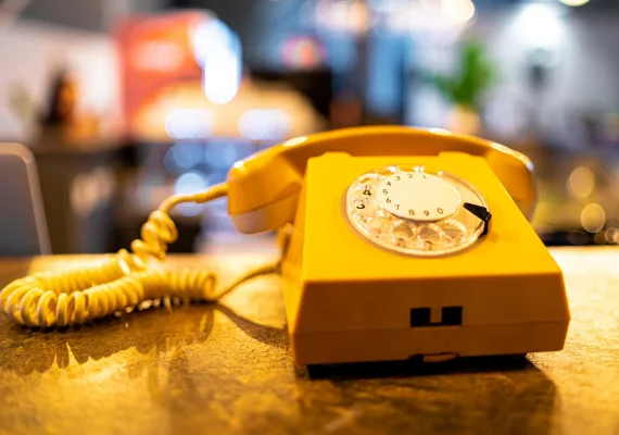 Yellow phone on a countertop